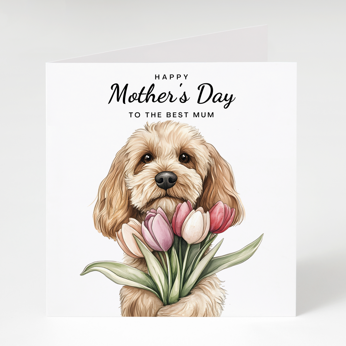 Greeting card with white and tan cockapoo dog holding flowers and 'Happy Mother's Day to the best mum' text on a white background.