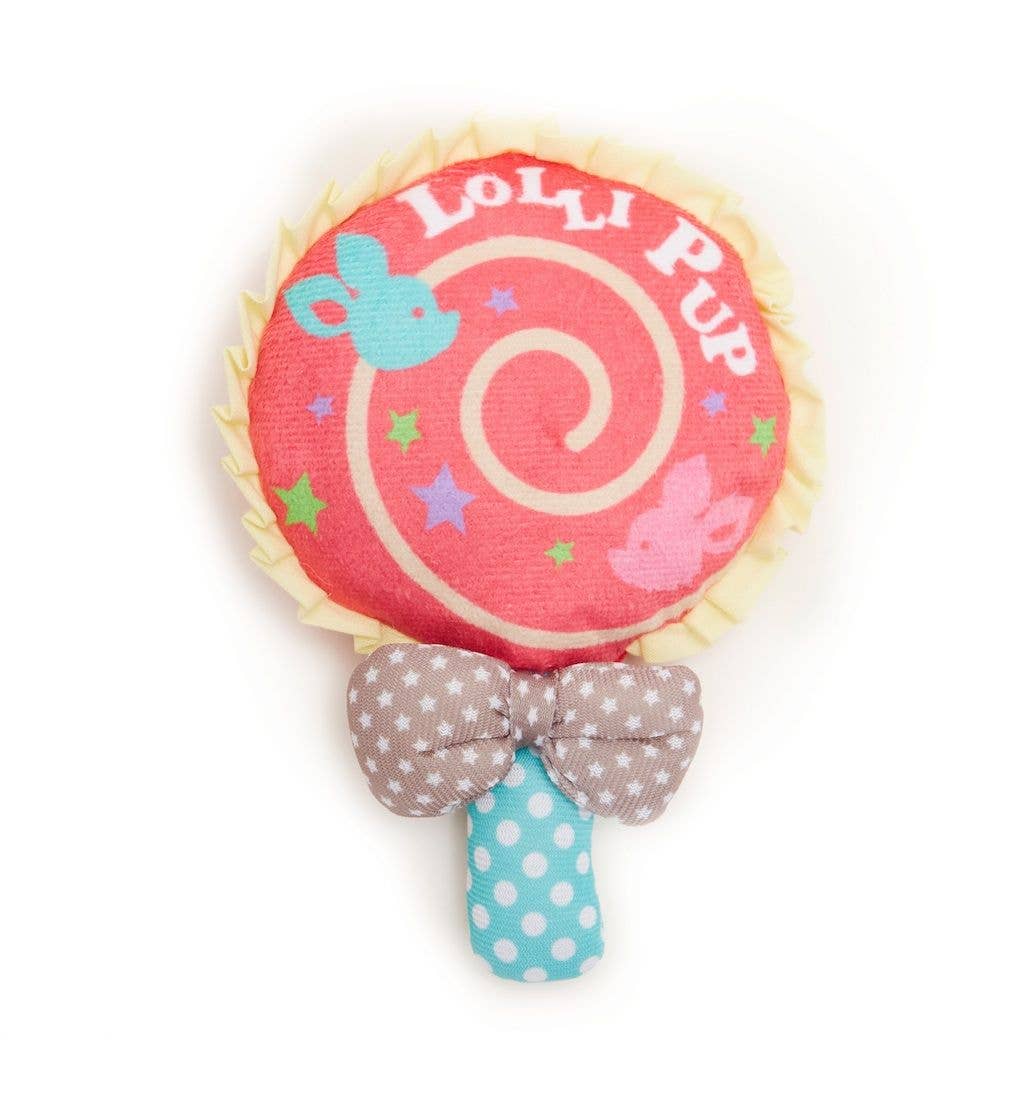 Toy with a pink lollipop design and polka dot bow on a white background