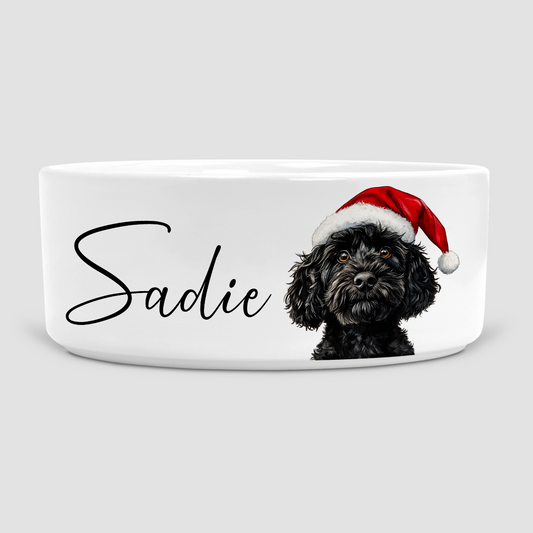 Christmas Dog bowl with a black cockapoo wearing a Santa hat personalised with dogs name