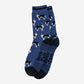 Blue socks with border collie dog pattern and 'Sock Talk' text on a white background