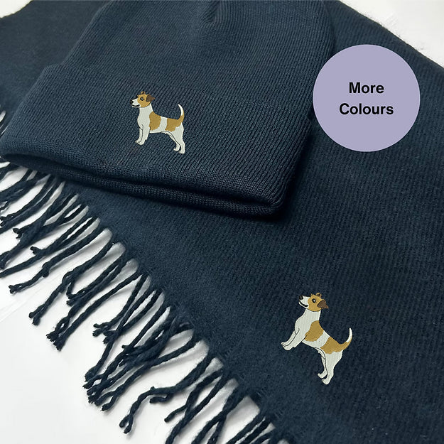Navy beanie hat and tasselled scarf with white and tan Jack Russell embroidery on both pieces.