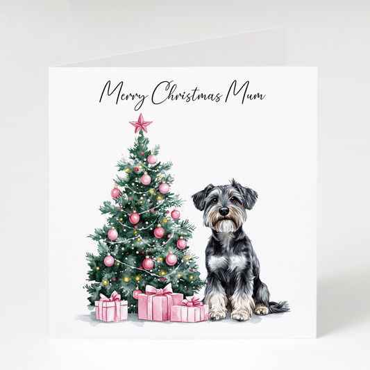 Christmas card with a Schnauzer and decorated tree on a white background